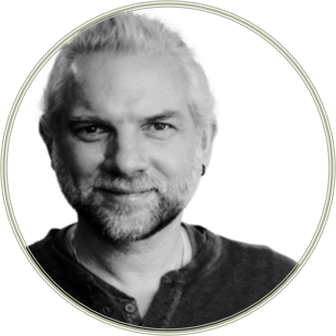 A black and white headshot of Professor Andrew Briggs